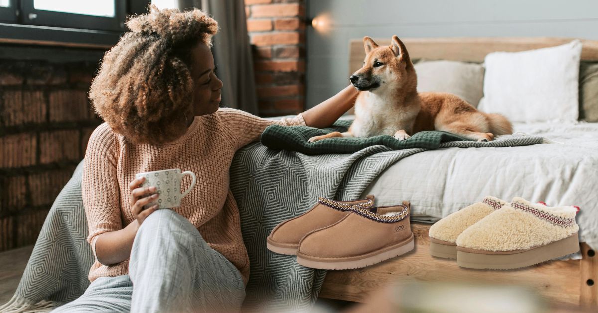 a homebody playing with his dog while wearing UGG slippers