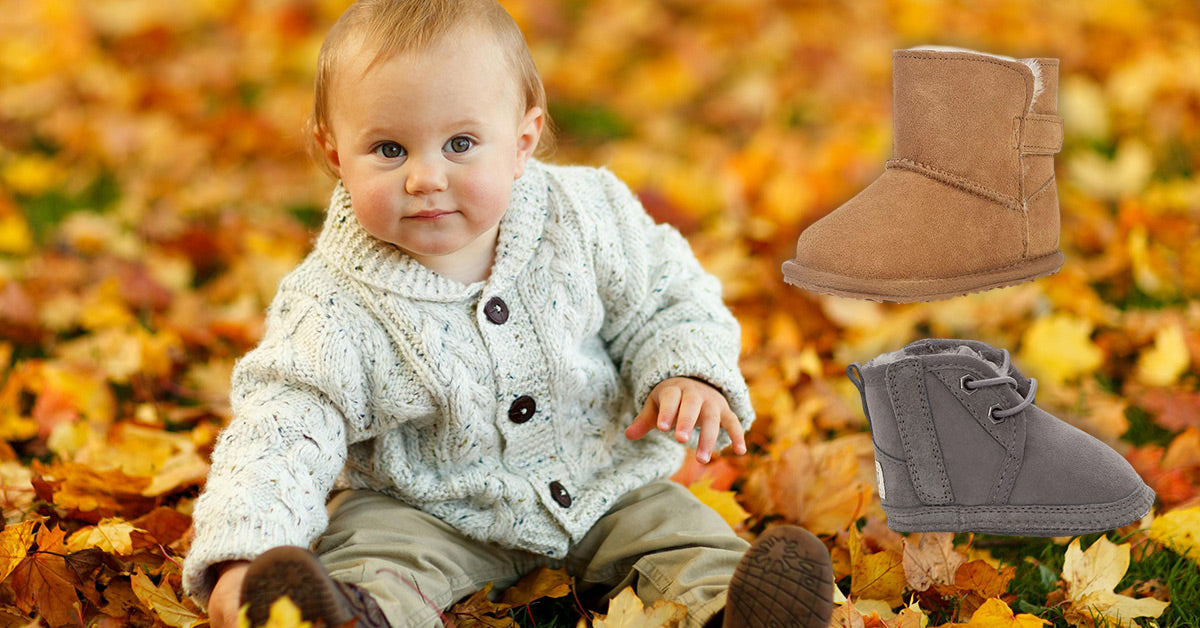 baby playing outside wearing UGG boots with warmers
