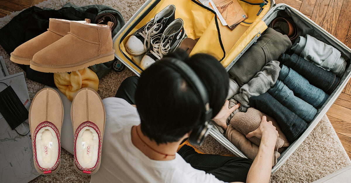 man packing his stuff in a luggage with UGGs for his hotel stay