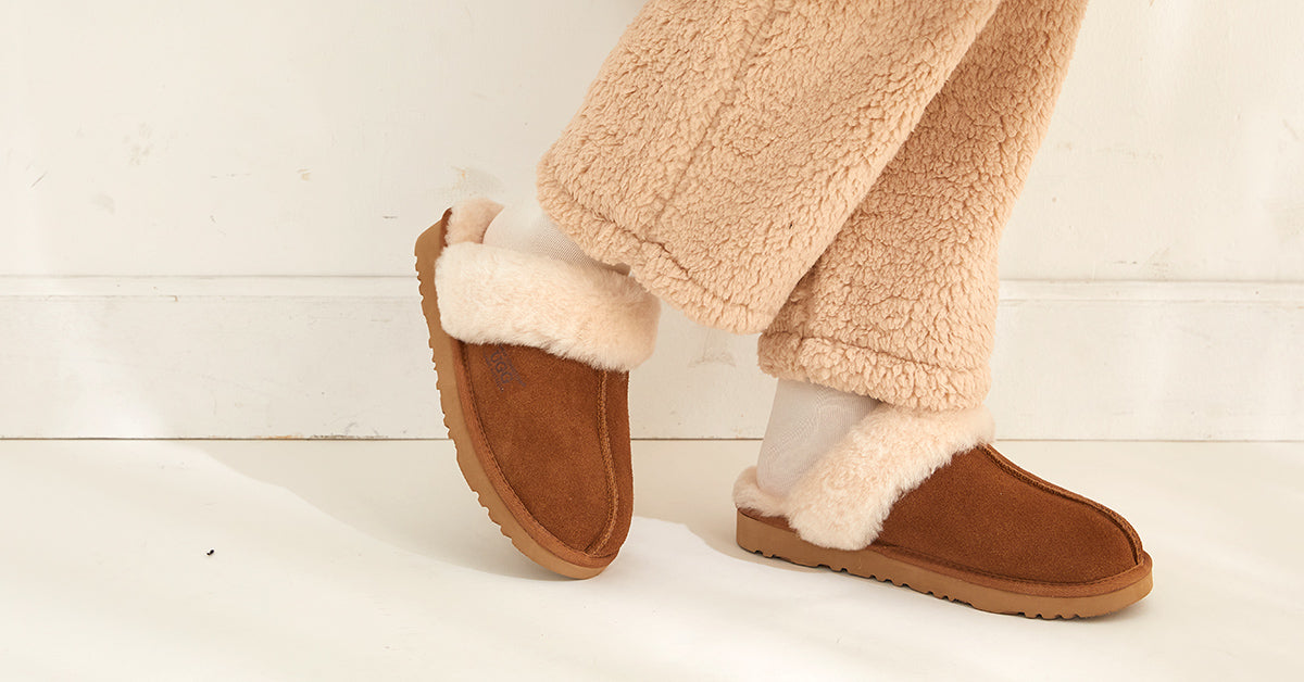 warm feet on winter while wearing UGG slippers and socks