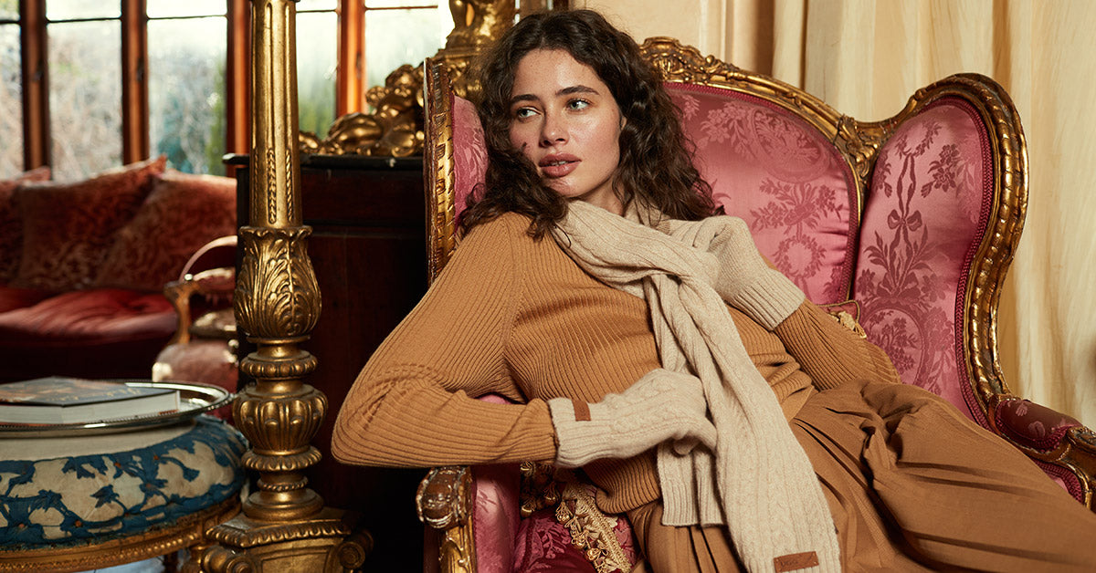 woman feeling warm while sitting down with UGG scarf