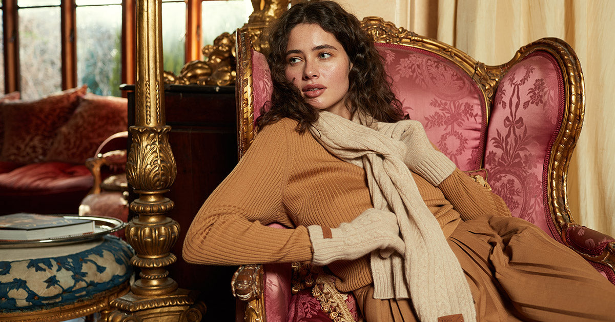 woman posing for a prenup shoot and wearing UGG Scarves