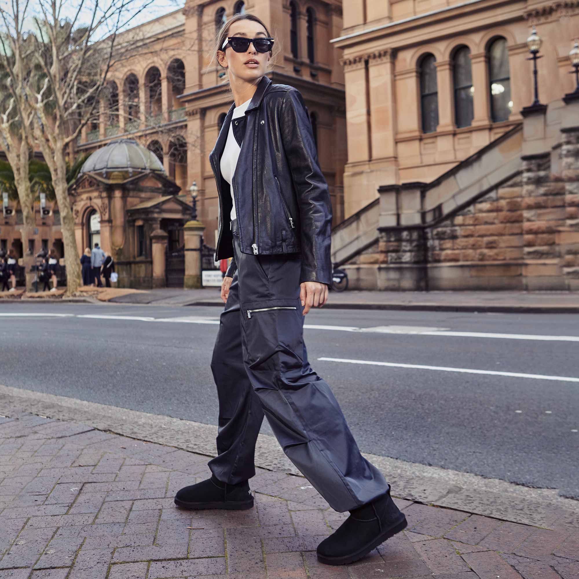 woman walking around the city of Australia looking cool with her cargo pants and UGG minis