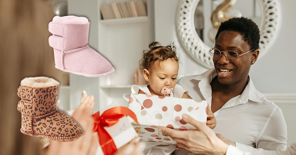 father showing baby girl new UGG boots as baby shower gift.jpg