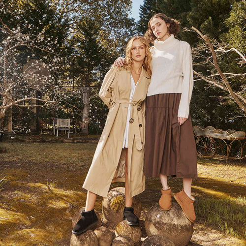 two-woman-having-a-backyard-bonding-while-wearing-classic-ugg-boots