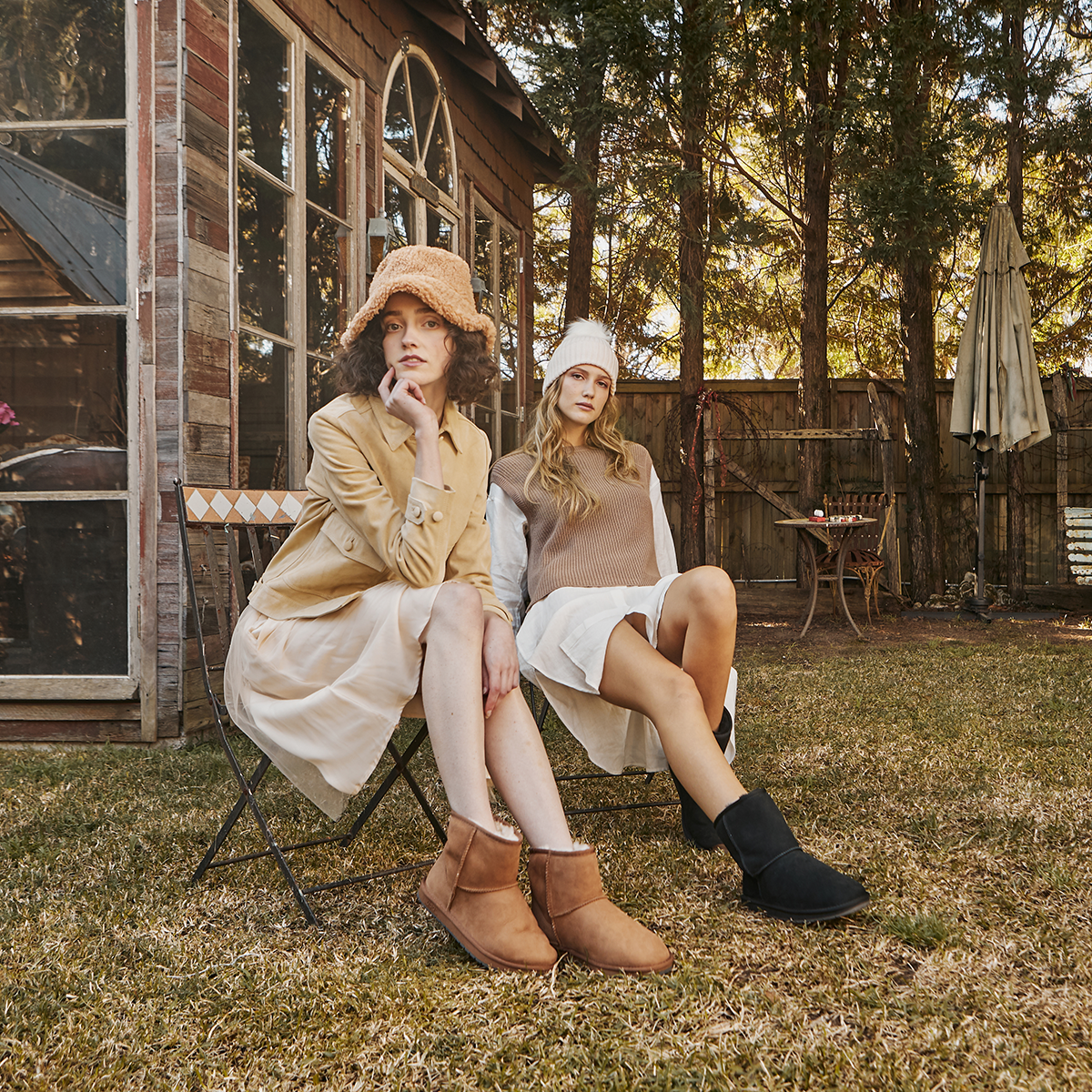 two women wearing UGG boots outside in daytime