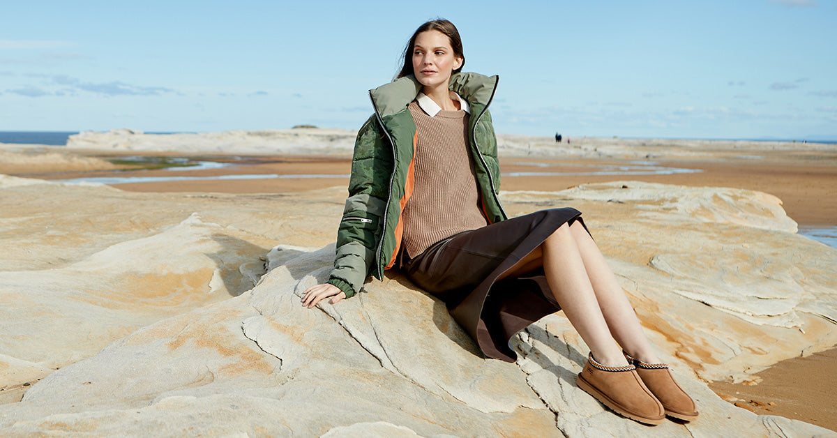 woman relaxing while wearing streetwear and UGG slippers